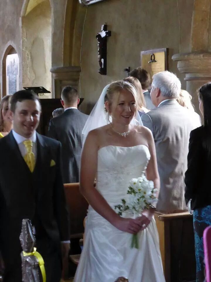 Dan and I walking down the aisle as a married couple