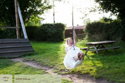 Going down the zipwire in my wedding dress