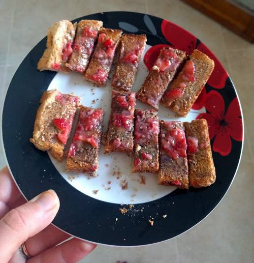 Toast with almond butter and strawberries
