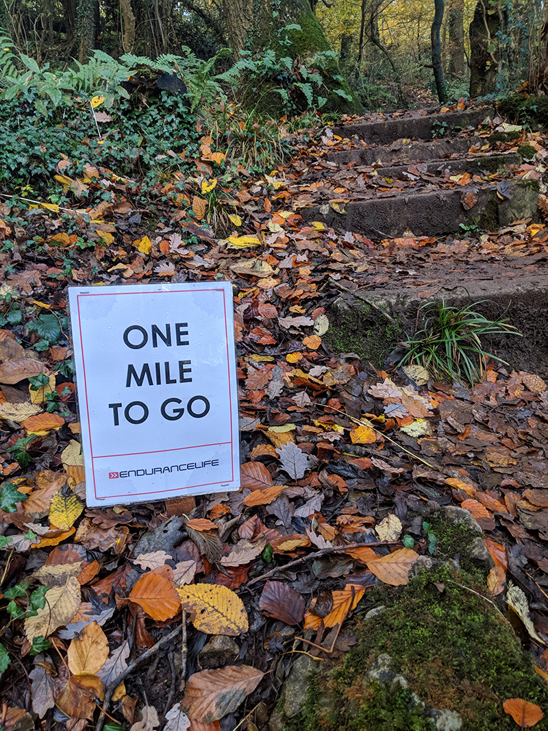 One mile to go sign at the EnduranceLife Gower Marathon